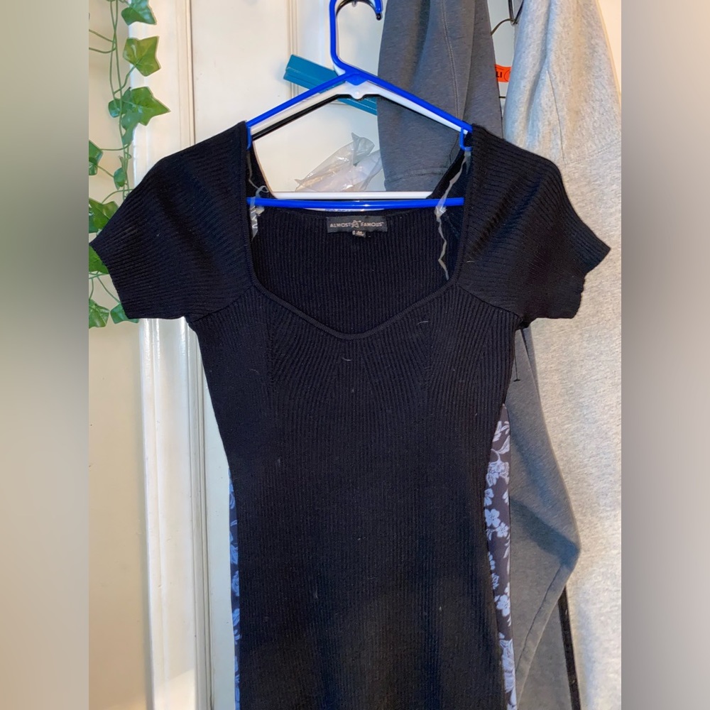 Medium, black, form fitting dress